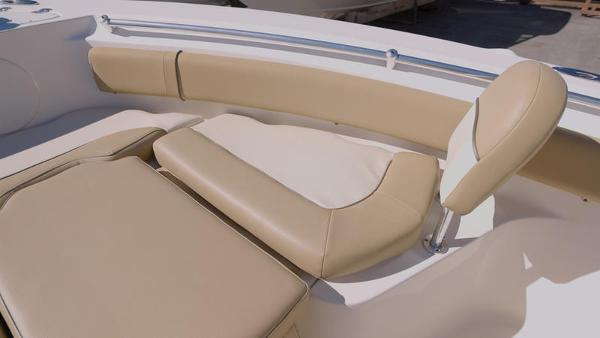 Slide: The Image of 2018 Key West 239FS boat with beige cushioned seating. - 6