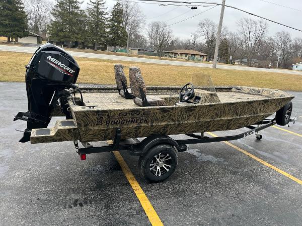 Slide: The Image of 2024 Lowe Roughneck RX1660 SC boat with Mercury outboard motor on trailer. - 3