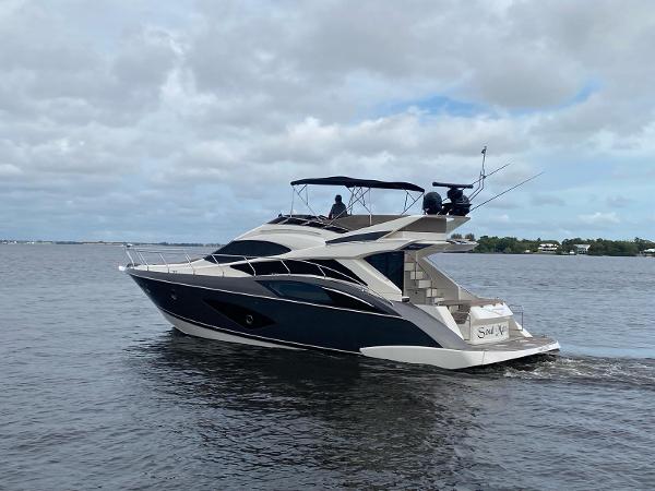Slide: The Image of 2017 Marquis 500 Sport Yacht cruising on a calm, cloudy day. - 1