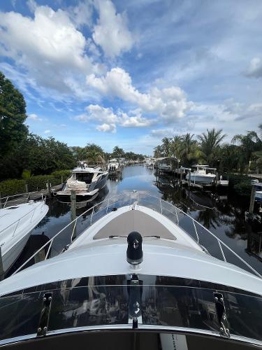 Slide: The Image of 2017 Marquis 500 Sport Yacht docked in a scenic marina. - 17