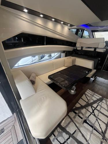 Slide: The Image of Interior of 2017 Marquis 500 Sport Yacht with white leather seating and modern decor. - 31