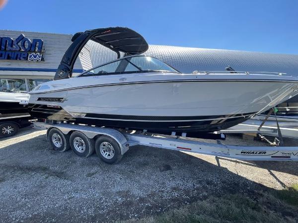 Slide: The Image of 2023 Monterey 278SS boat on a trailer outside a dealership. - 1