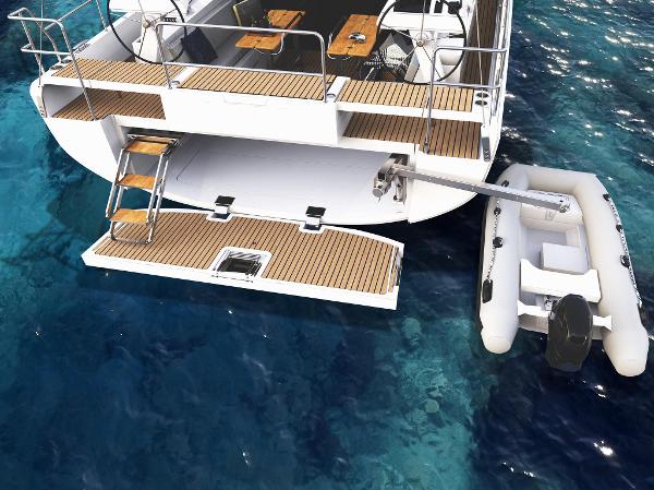 Slide: The Image of 2024 Moody 48 Deck Saloon yacht with tender in clear blue water. - 4