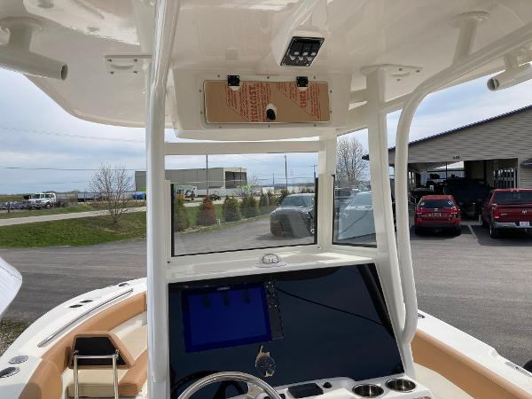 Slide: The Image of 2023 NauticStar 24 Legacy boat dashboard and helm station. - 14