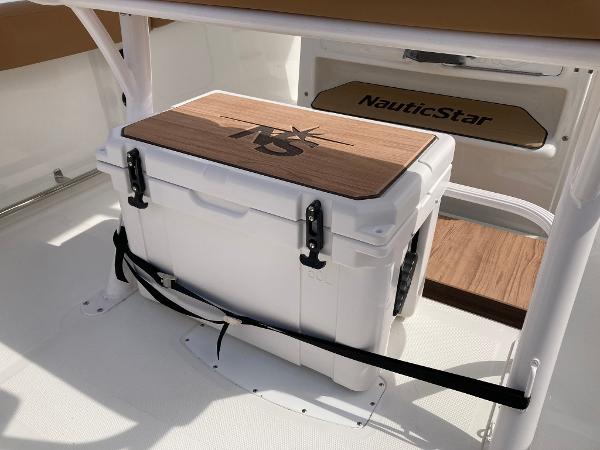 Slide: The Image of 2023 NauticStar 24 Legacy boat with secured cooler. - 15