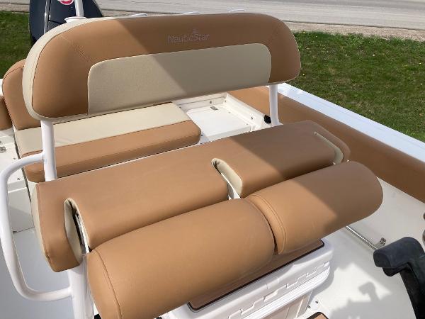 Slide: The Image of 2023 NauticStar 24 Legacy boat with tan and beige seating. - 4