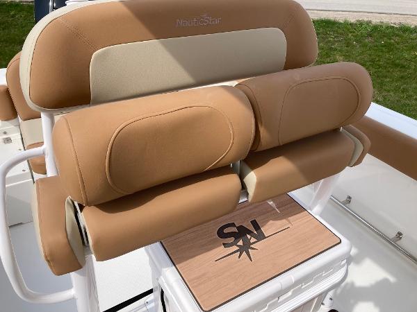 Slide: The Image of 2023 NauticStar 24 Legacy boat seating with tan and beige upholstery. - 5