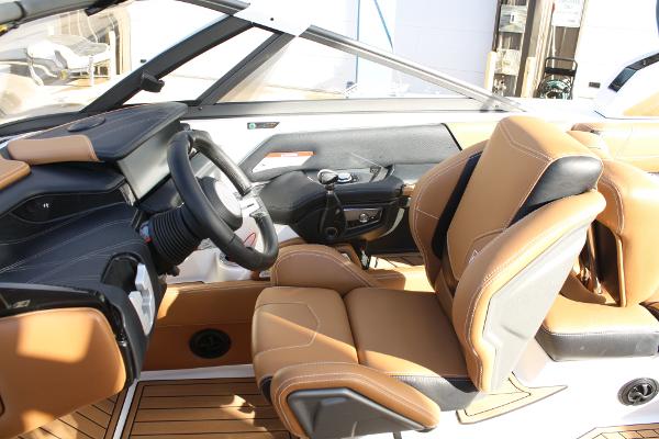 Slide: The Image of 2017 Nautique Super Air G23 interior with tan leather seats and modern dashboard. - 17