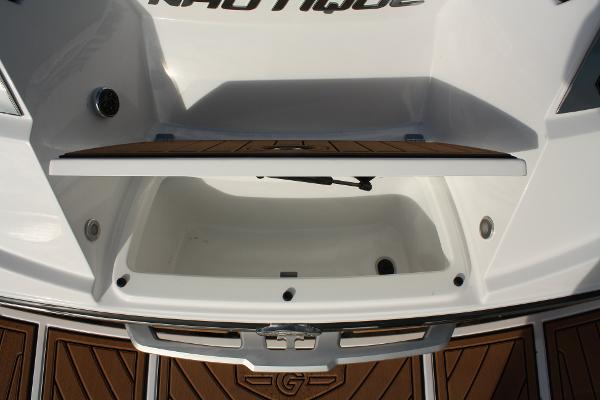 Slide: The Image of 2017 Nautique Super Air G23 storage compartment with teak flooring. - 26