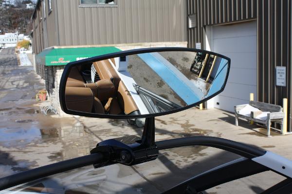 Slide: The Image of 2017 Nautique Super Air G23 rearview mirror reflecting boat interior. - 27
