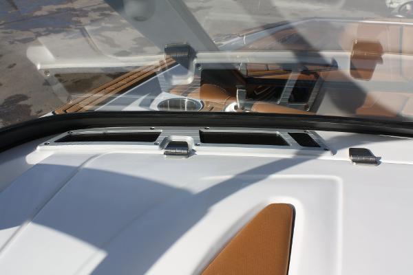 Slide: The Image of 2017 Nautique Super Air G23 boat dashboard with sleek design and modern controls. - 28
