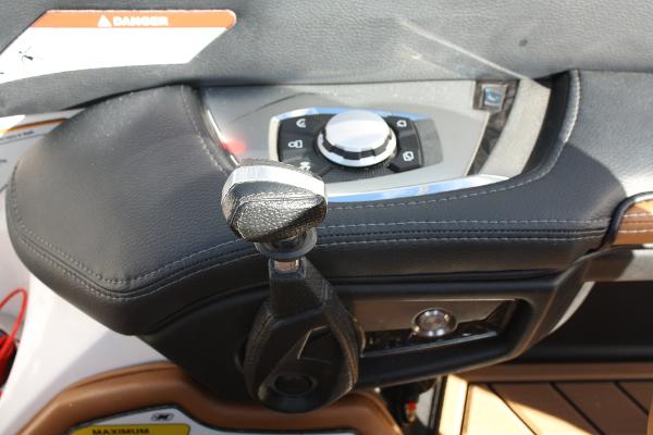 Slide: The Image of 2017 Nautique Super Air G23 control panel with throttle and navigation controls. - 30