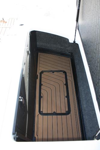 Slide: The Image of 2017 Nautique Super Air G23 storage compartment with sleek interior design. - 34