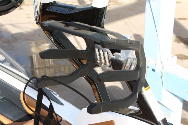 Slide: The Image of 2017 Nautique Super Air G23 wakeboard rack, black and silver design, mounted on boat. - 9