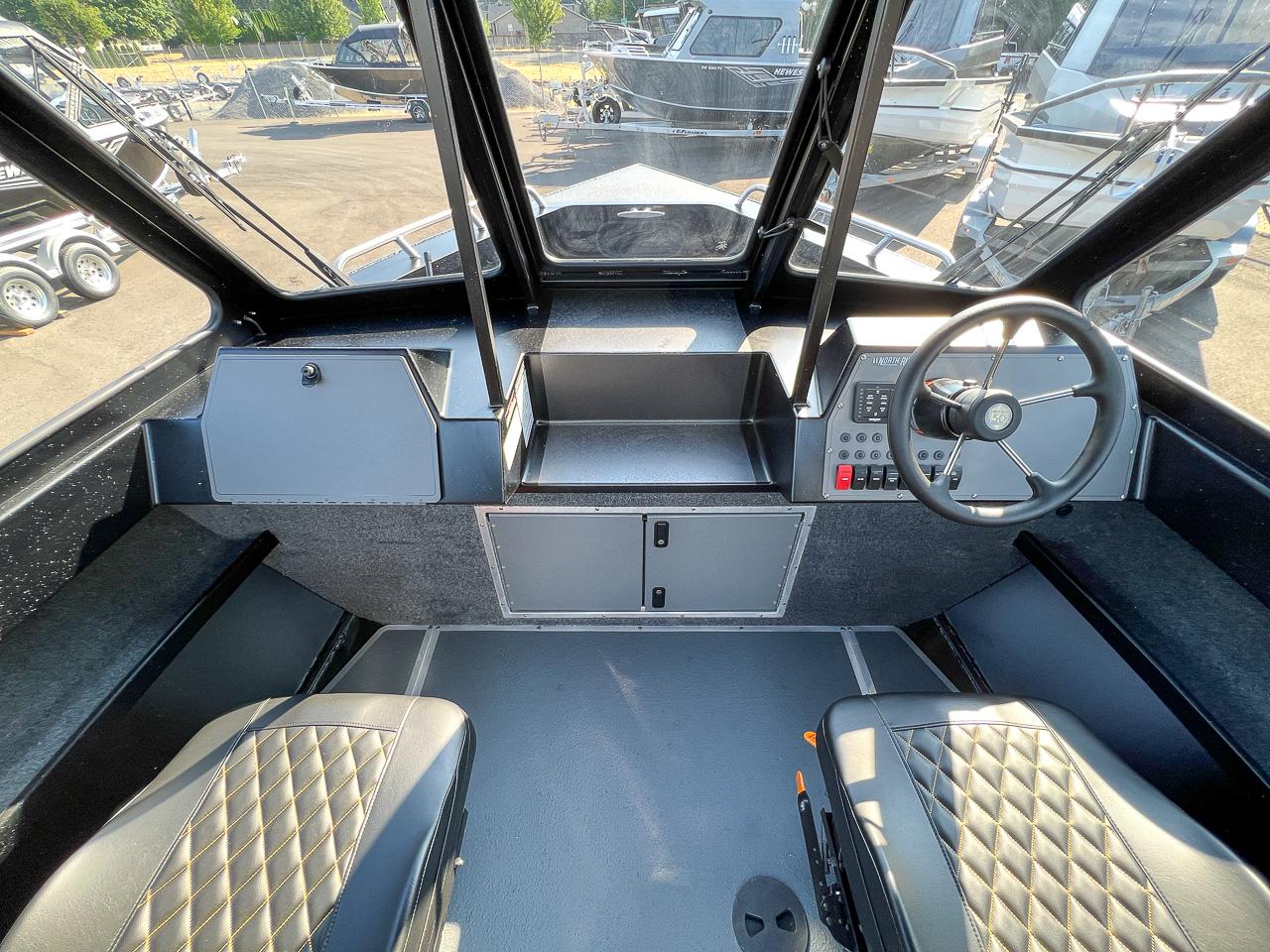 Slide: The Image of 2024 North River 21 SEAHAWK boat interior with steering wheel and dashboard. - 10