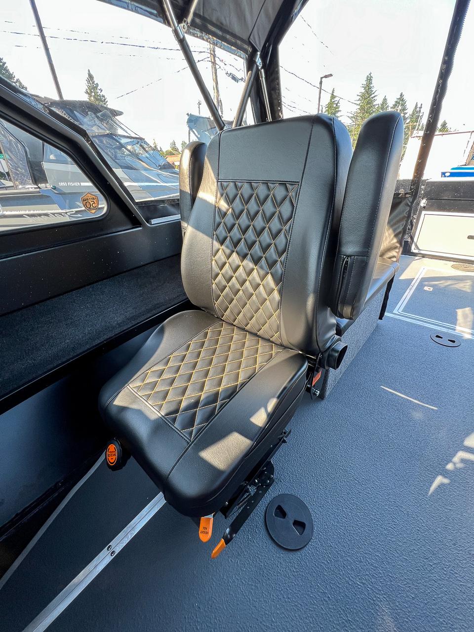 Slide: The Image of 2024 North River 21 SEAHAWK interior with diamond-stitched seat design. - 13