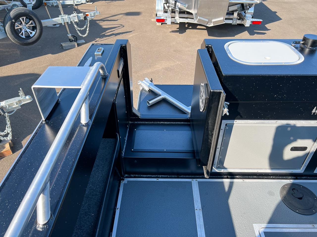 Slide: The Image of 2024 North River 21 SEAHAWK boat interior with storage compartments and metal fixtures. - 21