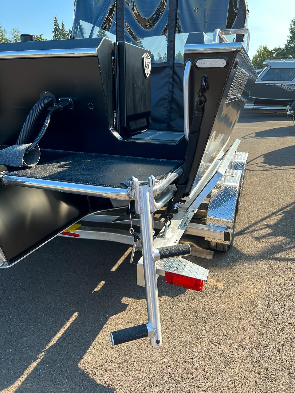 Slide: The Image of 2024 North River 21 SEAHAWK boat on a trailer, rear view with winch handle. - 22