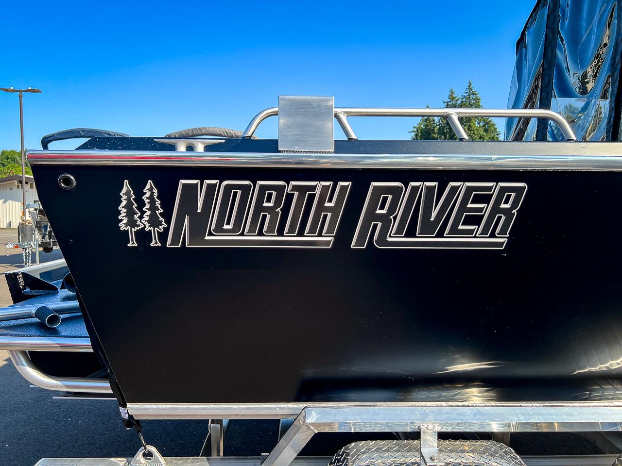 Slide: The Image of 2024 North River 21 SEAHAWK boat side view with logo. - 26