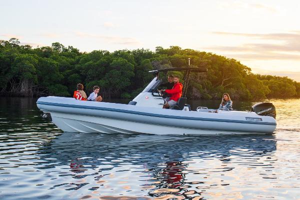 Slide: The Image of 2024 Northstar Orion 8 boat cruising on a calm river with passengers. - 16