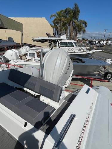 Slide: The Image of 2024 Northstar Orion 8 boat with Yamaha outboard motor in a marina. - 2