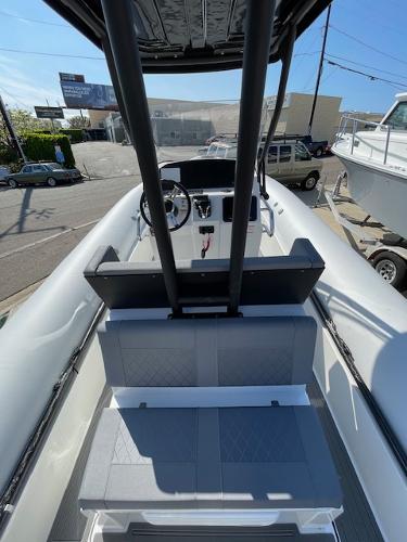 Slide: The Image of 2024 Northstar Orion 8 boat interior with steering console and seating. - 3