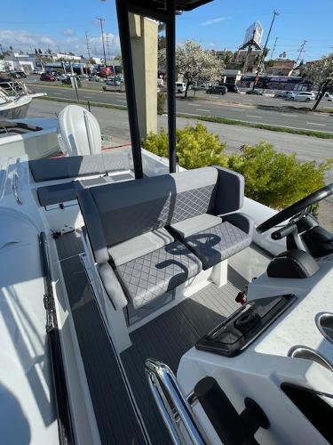 Slide: The Image of 2024 Northstar Orion 8 boat interior with gray seating and modern dashboard. - 5