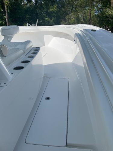 Slide: The Image of 2021 Onslow Bay 41 Tournament Edition boat interior with seating and cup holders. - 11