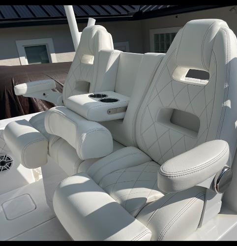 Slide: The Image of Luxurious white seating on 2021 Onslow Bay 41 Tournament Edition boat. - 15