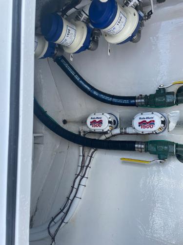 Slide: The Image of 2021 Onslow Bay 41 Tournament Edition bilge area with pumps and hoses. - 23