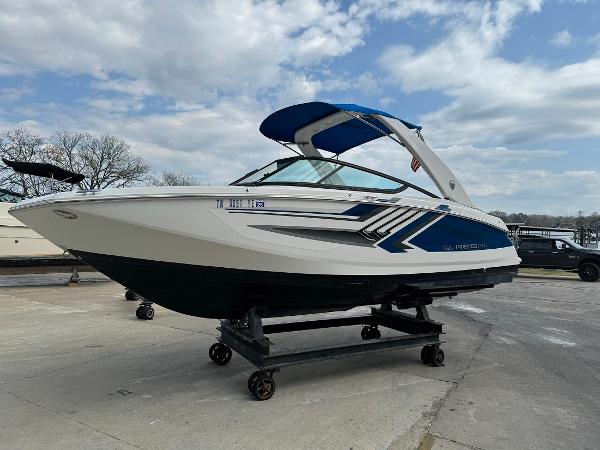 Slide: The Image of 2016 Regal 22 FasDeck ESX boat on a trailer, ready for transport. - 1