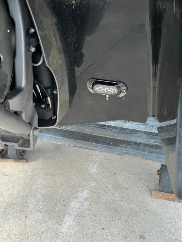 Slide: The Image of Close-up of a 2016 Regal 22 FasDeck ESX boat's stern on a trailer. - 12