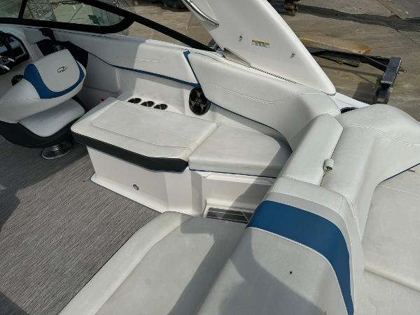 Slide: The Image of 2016 Regal 22 FasDeck ESX boat interior with white and blue seating. - 15