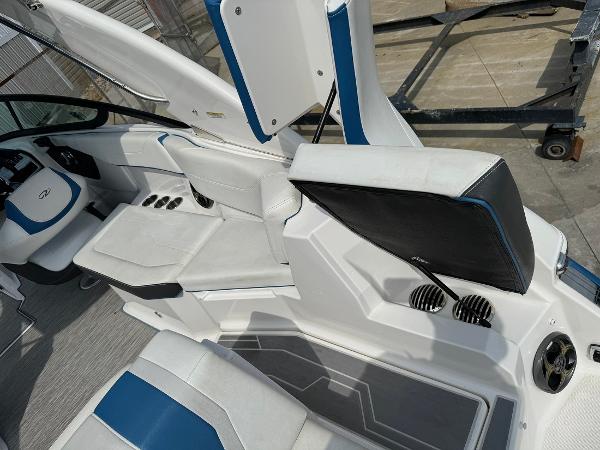 Slide: The Image of 2016 Regal 22 FasDeck ESX boat interior with white and blue seating. - 16
