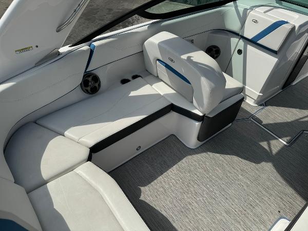 Slide: The Image of 2016 Regal 22 FasDeck ESX boat interior with white and blue seating. - 17