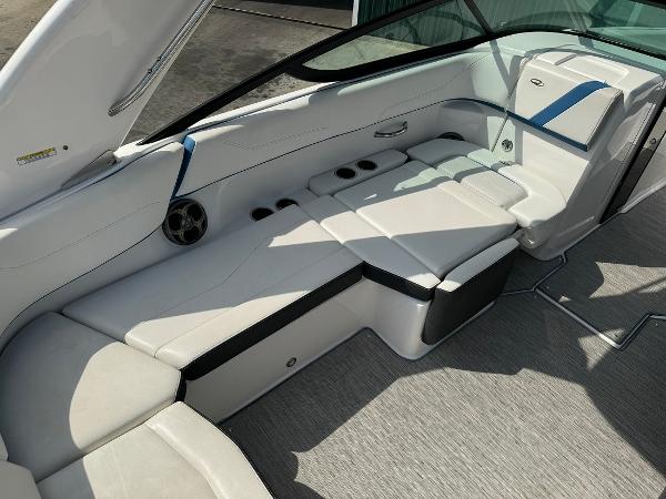 Slide: The Image of 2016 Regal 22 FasDeck ESX boat interior with white and black seating. - 18