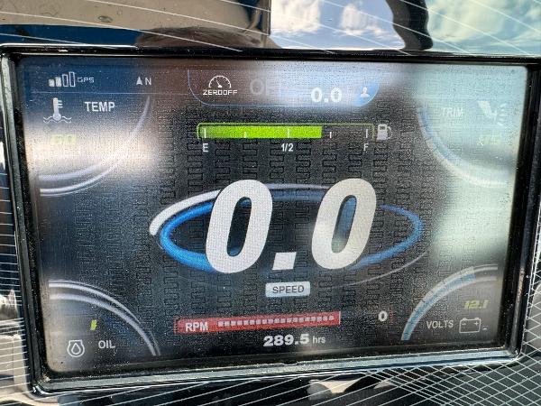 Slide: The Image of Digital dashboard of a 2016 Regal 22 FasDeck ESX boat showing speed, RPM, and fuel levels. - 23