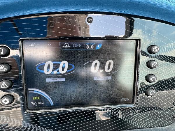 Slide: The Image of Dashboard display of a 2016 Regal 22 FasDeck ESX showing speed and trim settings. - 24