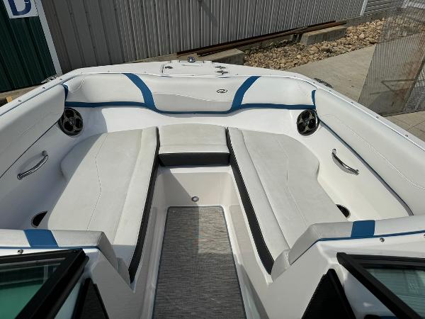 Slide: The Image of 2016 Regal 22 FasDeck ESX boat interior with white and blue seating. - 26