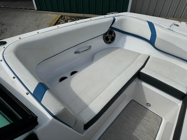 Slide: The Image of 2016 Regal 22 FasDeck ESX boat interior seating with white and blue upholstery. - 27