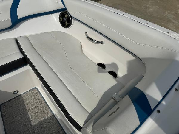 Slide: The Image of 2016 Regal 22 FasDeck ESX boat interior seating with white and blue upholstery. - 28