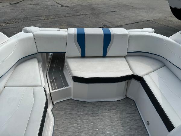 Slide: The Image of 2016 Regal 22 FasDeck ESX boat interior with white and blue seating. - 31
