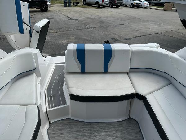 Slide: The Image of 2016 Regal 22 FasDeck ESX boat interior with white and blue seating. - 32