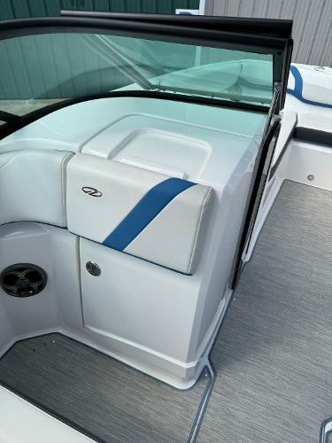 Slide: The Image of 2016 Regal 22 FasDeck ESX boat interior with white and blue seating. - 33