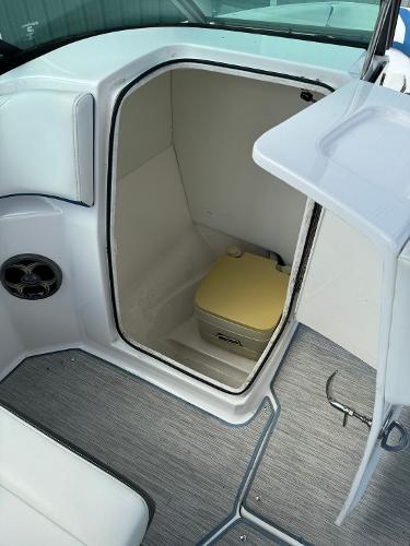 Slide: The Image of 2016 Regal 22 FasDeck ESX boat interior with a compact toilet. - 34