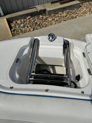 Slide: The Image of 2016 Regal 22 FasDeck ESX boat with a retracted ladder in the bow compartment. - 36