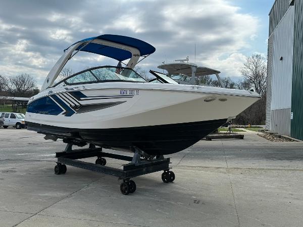 Slide: The Image of 2016 Regal 22 FasDeck ESX boat on a trailer, parked outdoors. - 5