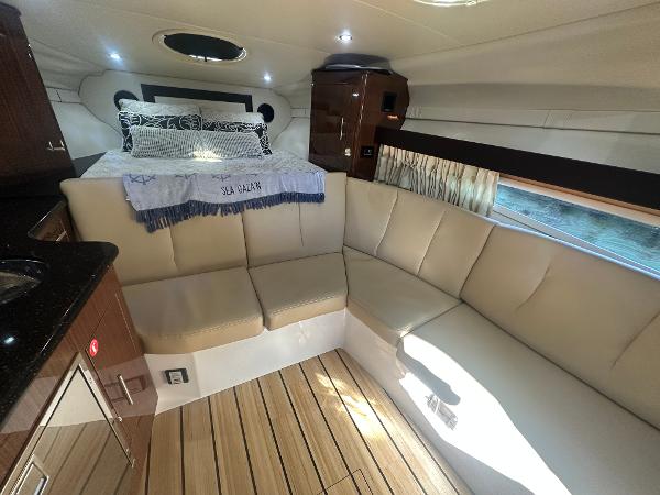 Slide: The Image of Luxurious interior of 2014 Regal 32 Express yacht with cozy seating and elegant decor. - 12