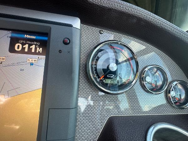 Slide: The Image of Dashboard of 2014 Regal 32 Express boat with GPS and gauges. - 21