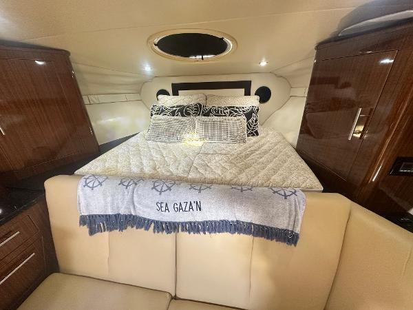 Slide: The Image of Luxurious cabin interior of 2014 Regal 32 Express yacht with cozy bedding. - 8